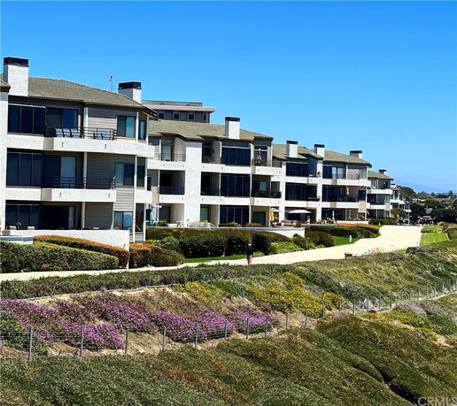 Front view of multi-story apartment buildings with balconies.