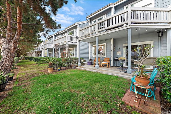 Front view of a two-story house with balconies.