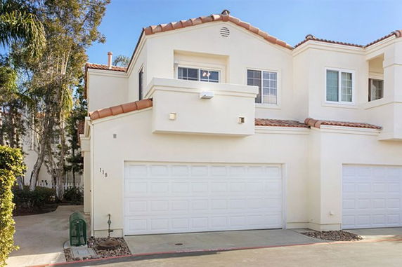 Front view of a two-story house with a double garage.