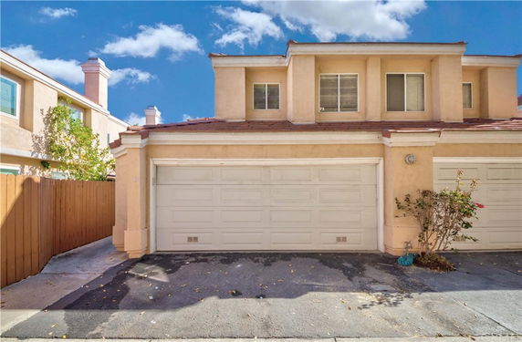 Front view of a two-story house with a double garage.