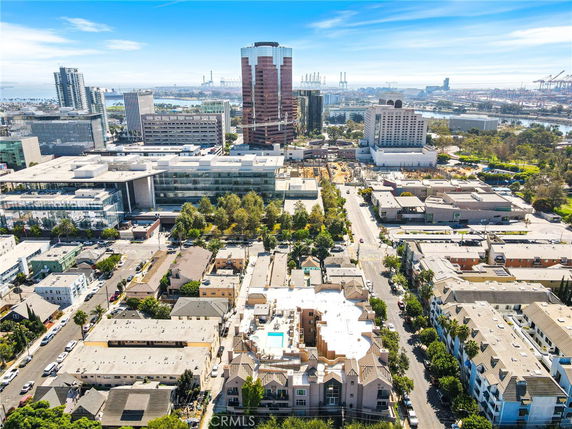 Panoramic view of a cityscape with various buildings and skyscrapers.