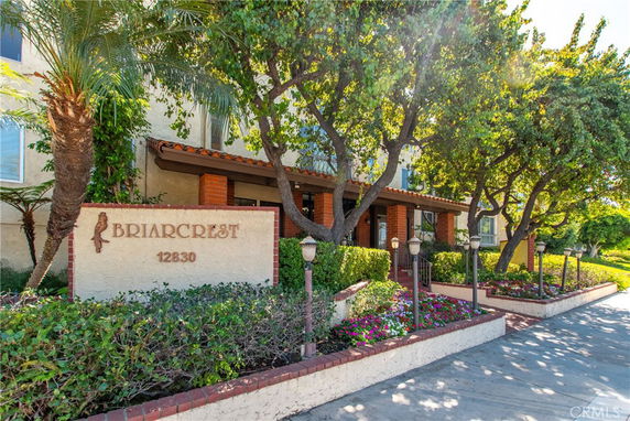 Front view of a multi-story building with a sign reading 'Briarcrest 12830'.