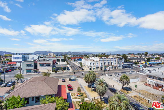 Panoramic view of urban surroundings including streets and buildings.