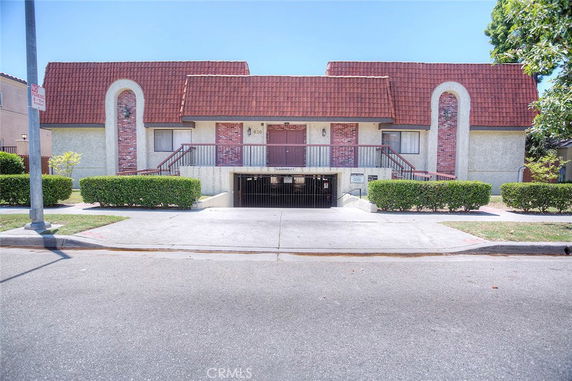 Front view of a building with a unique roof and entrance.
