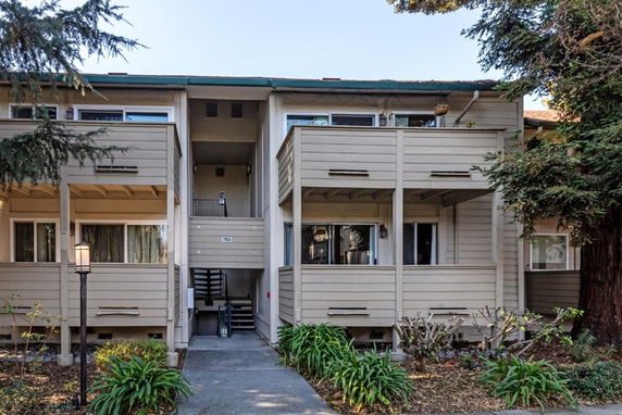Front view of a two-story residential building with balconies.