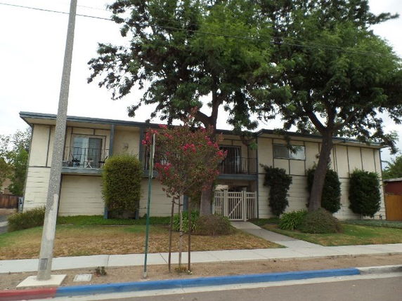 Front view of a two-story residential building with balconies.