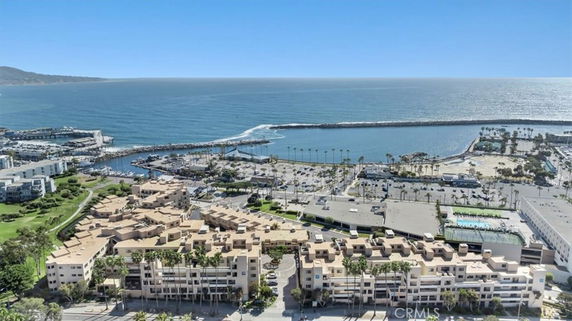 Panoramic view of coastal area with buildings and ocean in the background