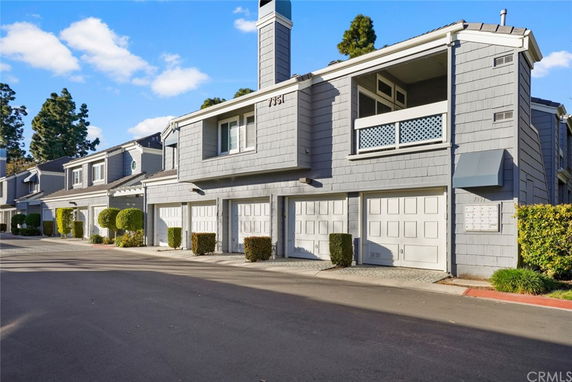 Front view of a townhouse with multiple garages.