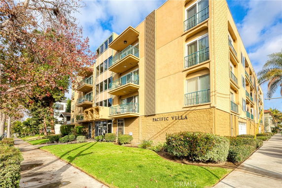 Front view of a multi-story building with balconies named Pacific Villa.