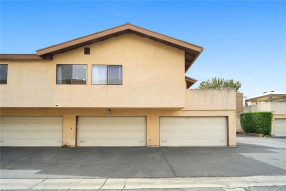 Front view of a two-story house with a double garage