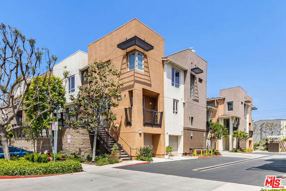 Front view of a multi-story residential building with a modern design.