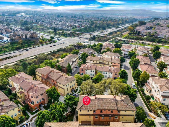 Aerial view of a residential neighborhood with multiple houses and roads.