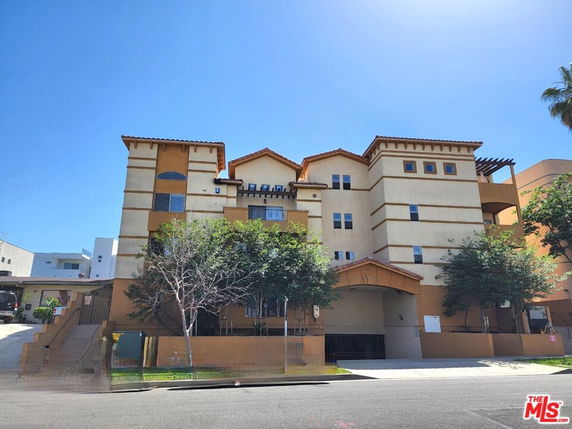 Front view of a multi-story residential building with distinct architectural design.