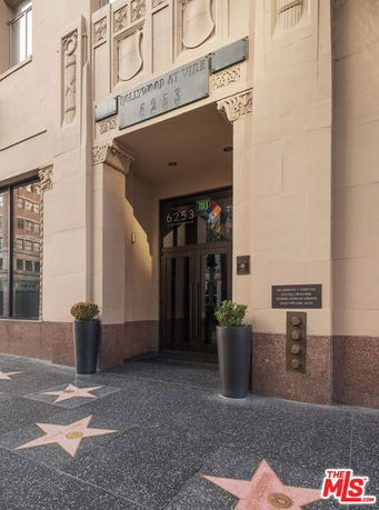 Front view of a building with decorative architectural details and a marked entrance at Hollywood and Vine.