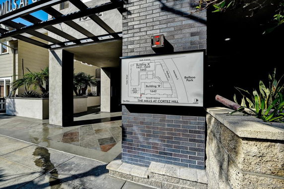 Front view of a building entrance with a map display.