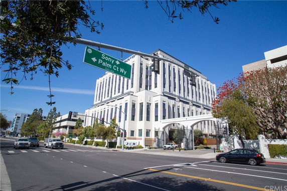 Front view of a multi-story building with modern architectural design.