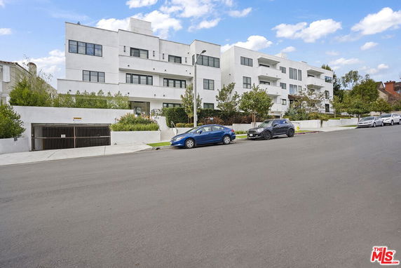 Front view of a modern multi-story apartment building.