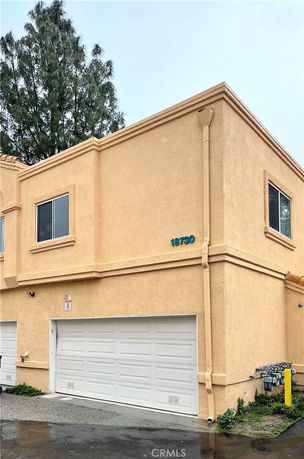 Front view of a two-story house with a double garage.