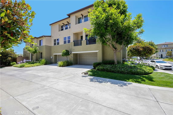 Front view of a multi-story house with a double garage.