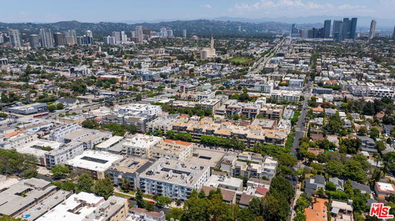 Panoramic view of a city with buildings and skyscrapers in the background.