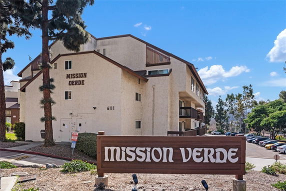 Front view of a multi-story building labeled Mission Verde.