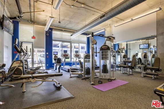 Interior view of a gym with various exercise equipment.