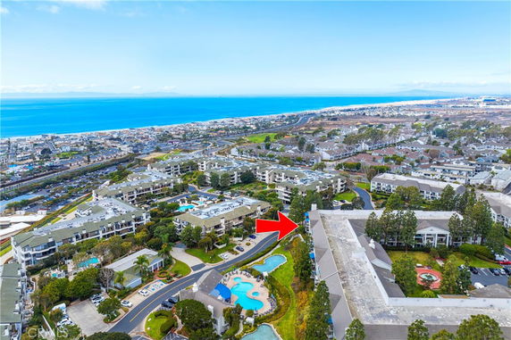 Aerial view of a large residential complex near the coastline.