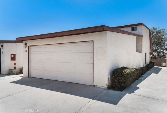 Front view of a residential building with a garage.