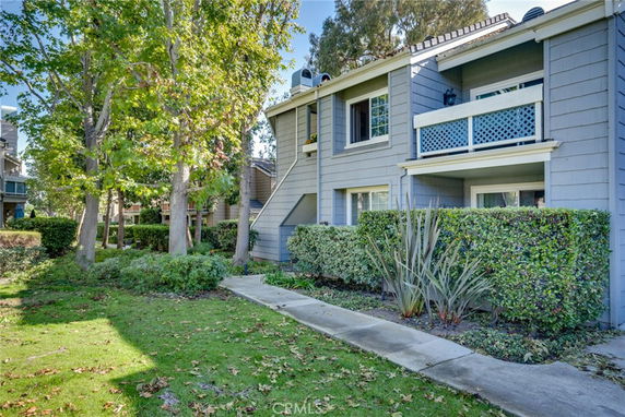 Front view of a two-story residential building with a balcony.