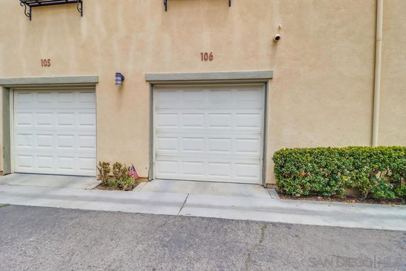Front view of a building with two garage doors labeled 105 and 106.