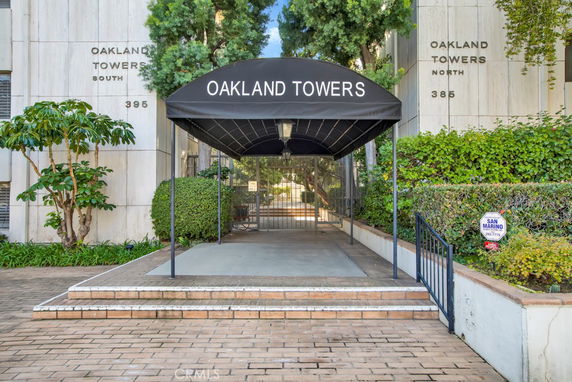 Front view of Oakland Towers with a covered entrance.