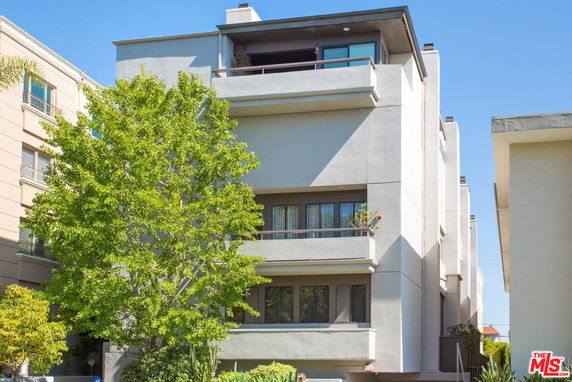 Front view of a modern multi-story apartment building.