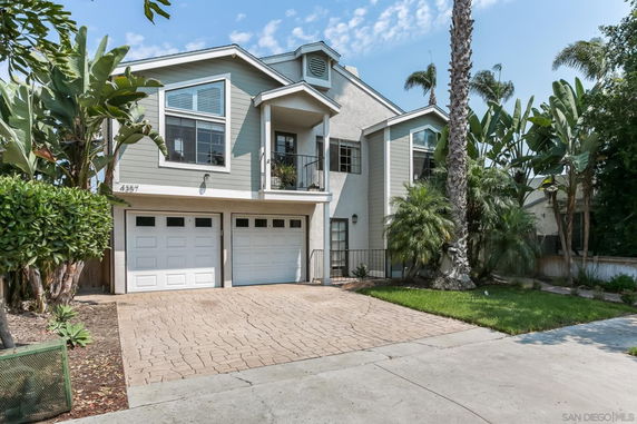 Front view of a two-story house with a double garage.