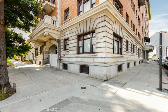 Front view of a multi-story building with ornate architectural details.