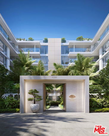 Front view of a modern multi-story apartment building with large glass balconies.