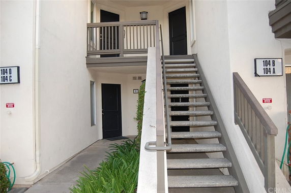 Front view of a building with stair access to multiple units.