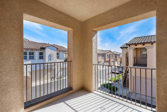 View from a balcony looking out over a residential neighborhood.