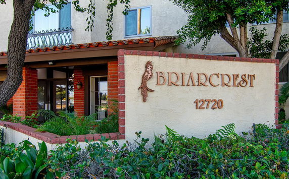 Front view of a building with signage reading 'Briarcrest' and the number '12720'.