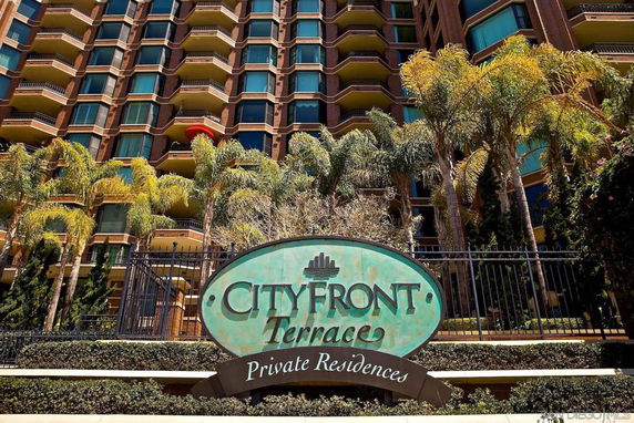 Front view of a multi-story residential building with balconies.