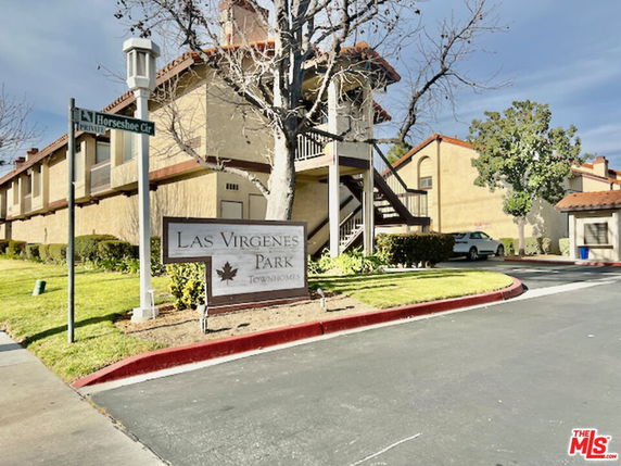 Front view of townhome buildings in a residential complex.