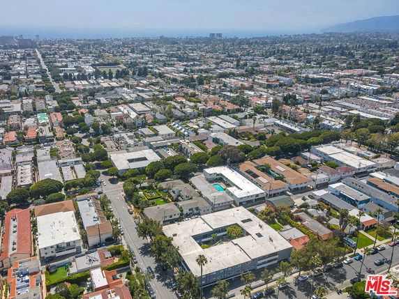 Aerial view of a residential area with multiple houses and buildings.