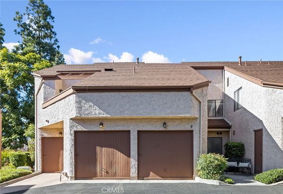 Front view of a two-story house with dual garages.