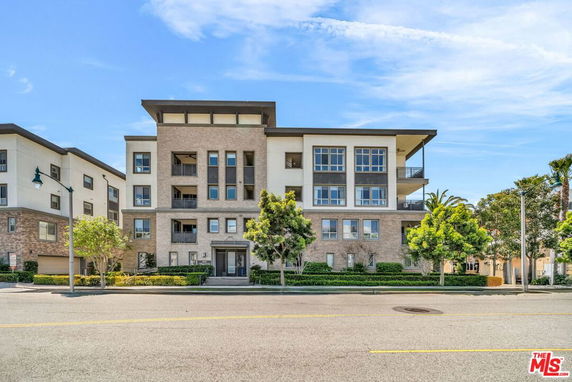 Front view of a modern multi-story apartment building.