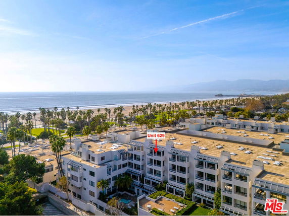 Panoramic view of a beachfront property complex with a unit labeled 629, overlooking the ocean.
