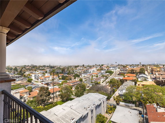 Panoramic view of surrounding residential area from a building balcony.