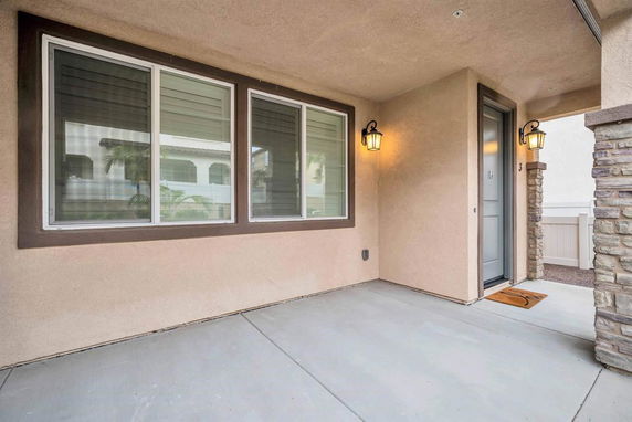 Front view of a house with a covered entrance.