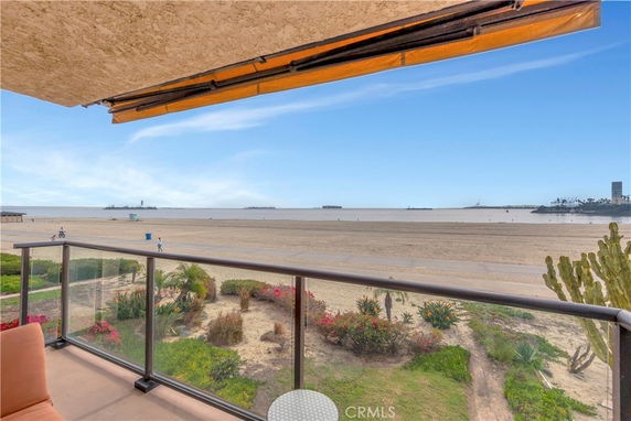 Panoramic view of a beach and ocean from a building.
