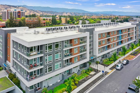 Front view of a modern multi-story apartment building.