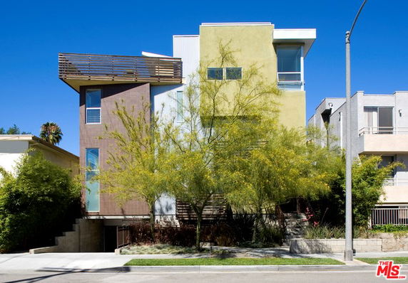 Front view of a contemporary multi-story building with modern architectural design.