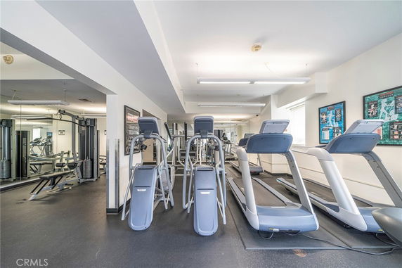 Interior view of a gym with treadmills and other exercise equipment.
